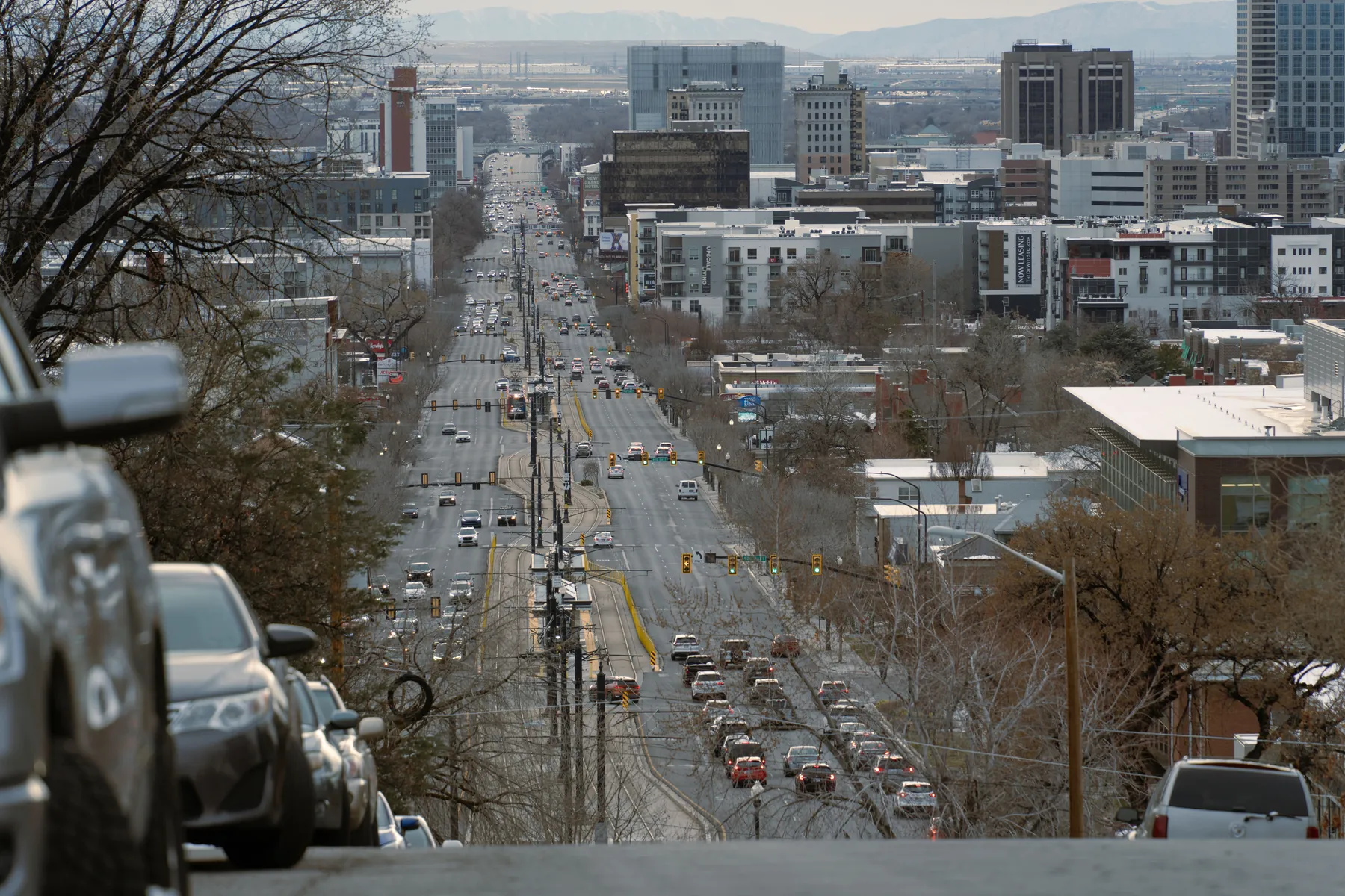 A downtown Salt Lake City street with the Wasatch Mountains beyond